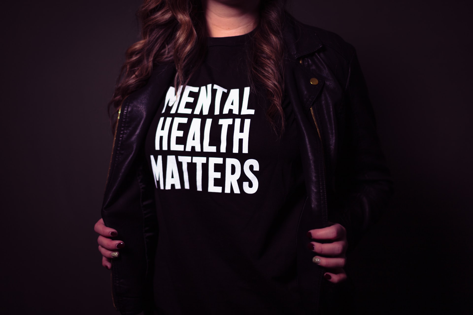 Woman wearing a t-shirt that reads Mental Health Matters