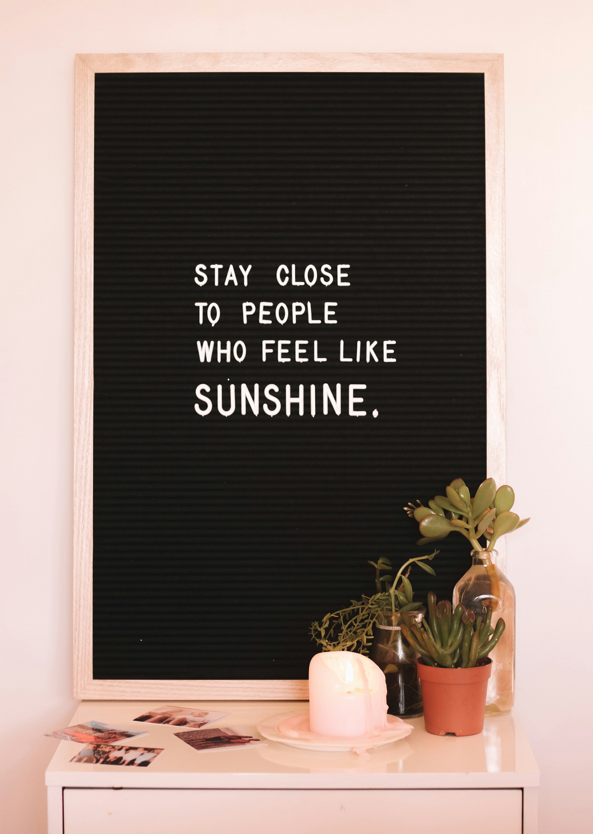 Sign board with the text Stay Close To People WHo Feel Like Sunshine